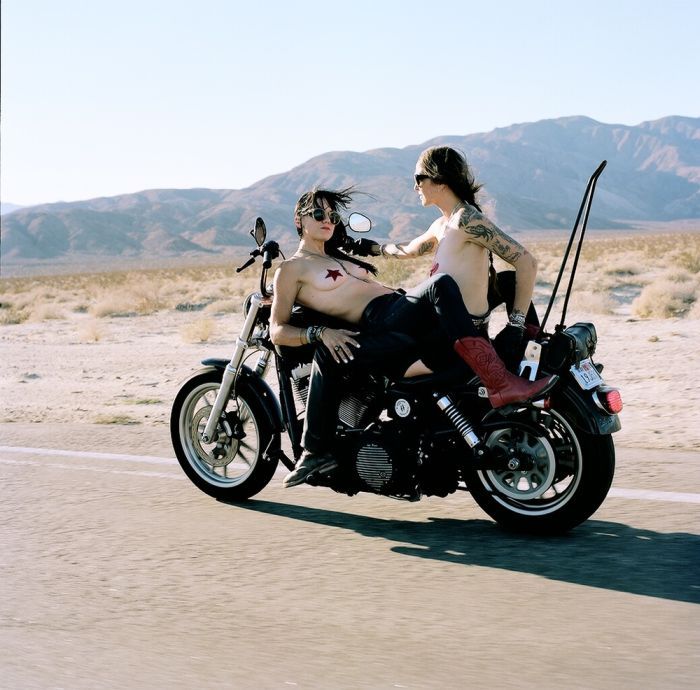 Girls on a motorcycle in Kananga